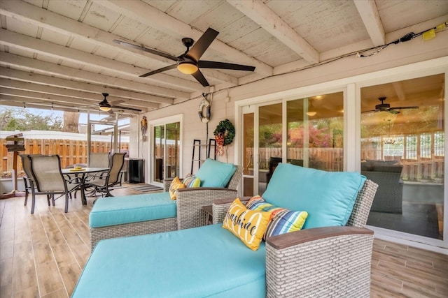 exterior space featuring ceiling fan, plenty of natural light, wooden ceiling, and beam ceiling