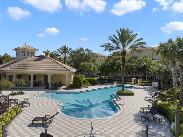 view of pool featuring a patio