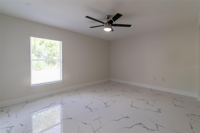 unfurnished room with ceiling fan