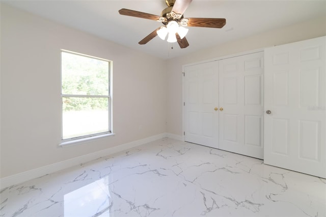 unfurnished bedroom with a closet and ceiling fan