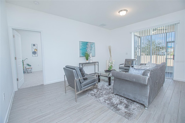 living room with light hardwood / wood-style floors