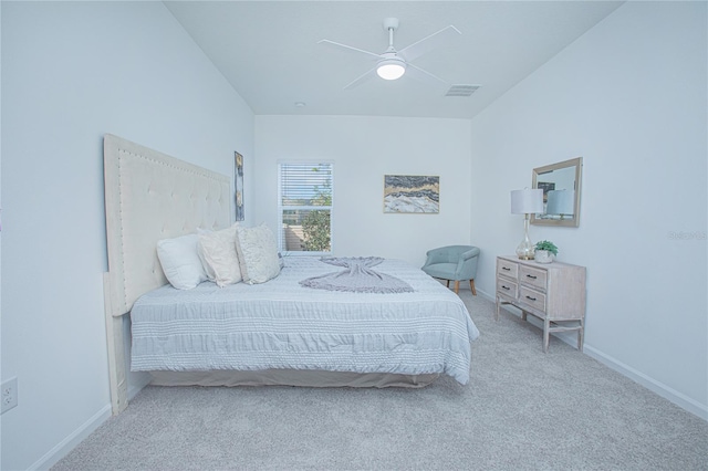 bedroom with ceiling fan and light carpet