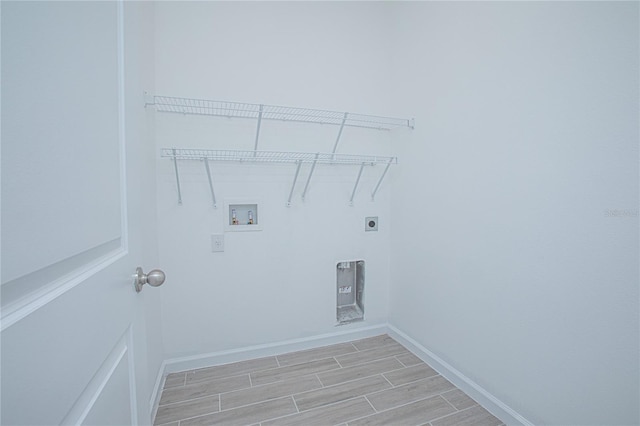 clothes washing area with hookup for a washing machine and electric dryer hookup