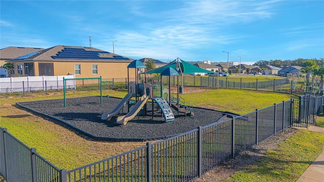 view of jungle gym with a lawn