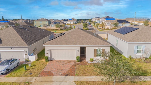 view of front facade with a front yard and a garage