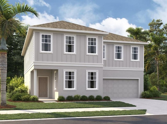 view of front of property featuring a garage and a front lawn