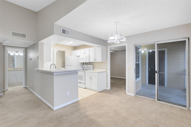 kitchen with white cabinetry, kitchen peninsula, white appliances, decorative light fixtures, and light carpet