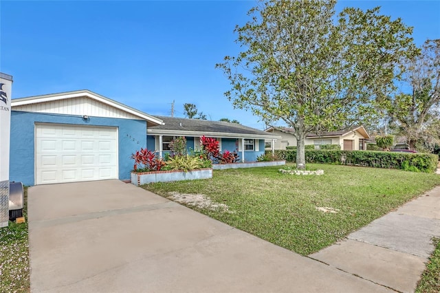 ranch-style home featuring a front lawn and a garage