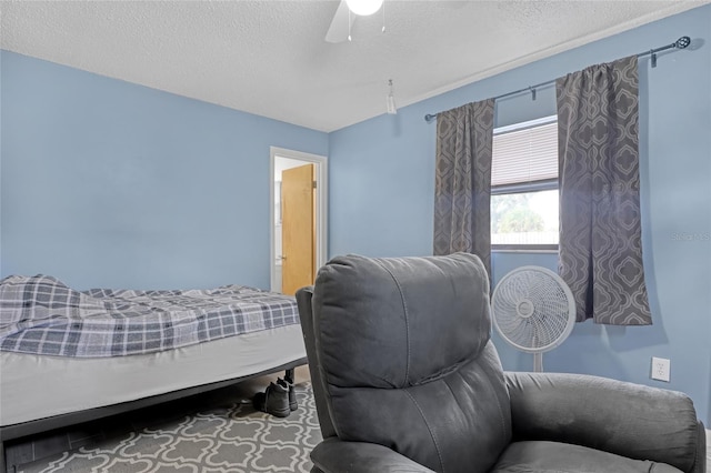 bedroom featuring a textured ceiling and ceiling fan