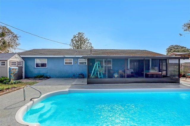 view of pool featuring a sunroom