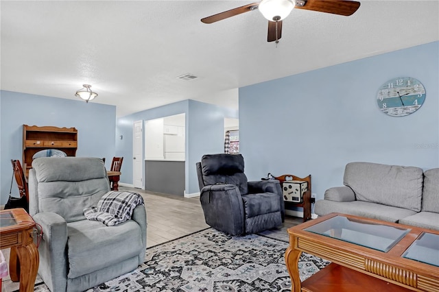 living room featuring ceiling fan