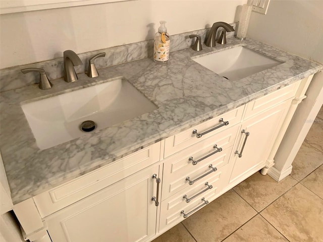 bathroom with tile patterned flooring and vanity