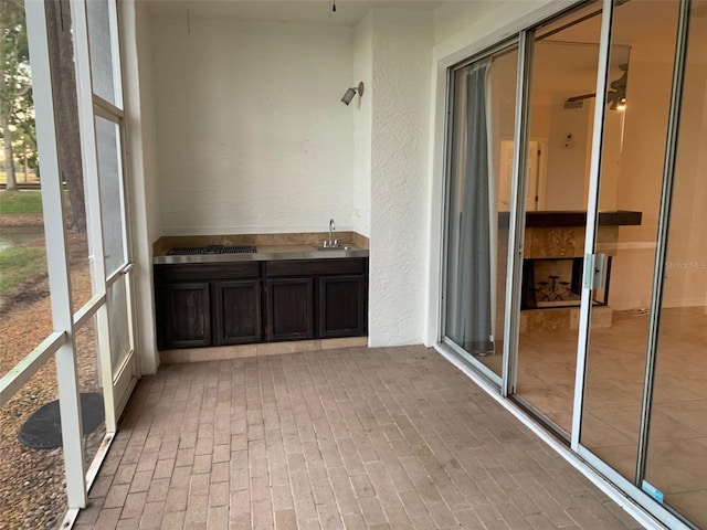 unfurnished sunroom featuring sink