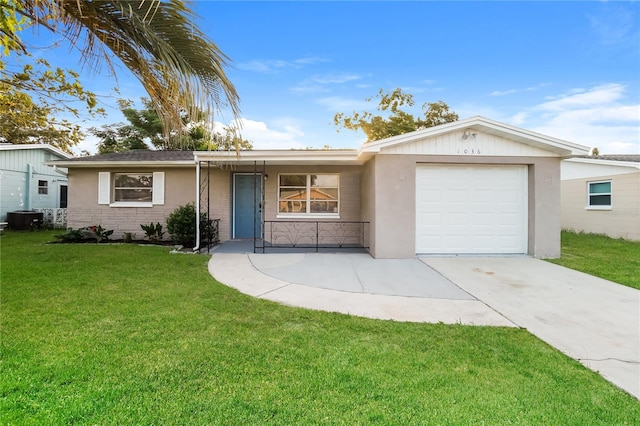 single story home with a front yard and a garage