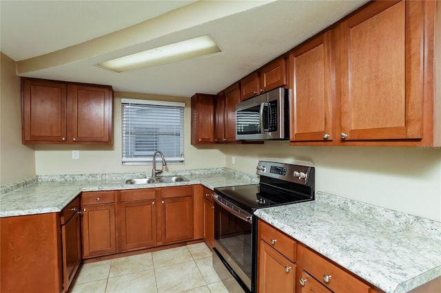 kitchen featuring black electric range oven, light tile patterned floors, and sink