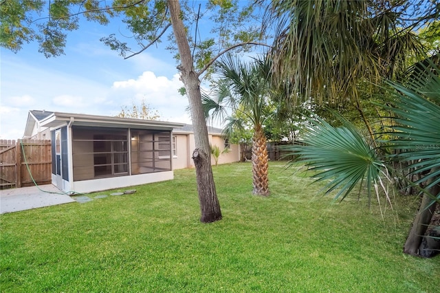 view of yard featuring a sunroom