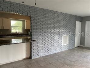 kitchen featuring dark countertops