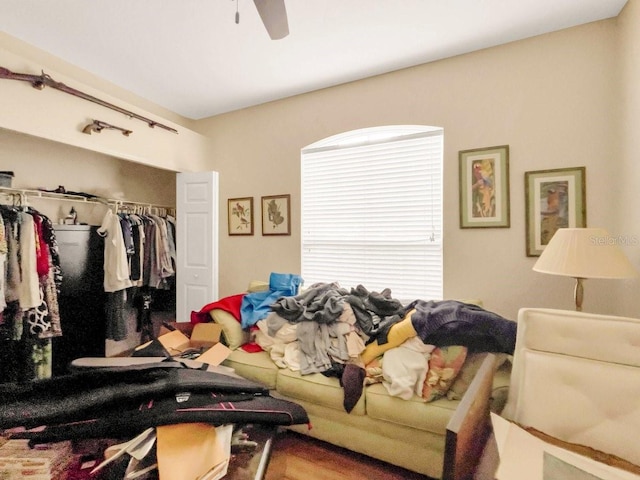 living room featuring hardwood / wood-style floors and ceiling fan