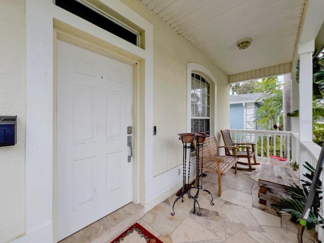 entrance to property with covered porch