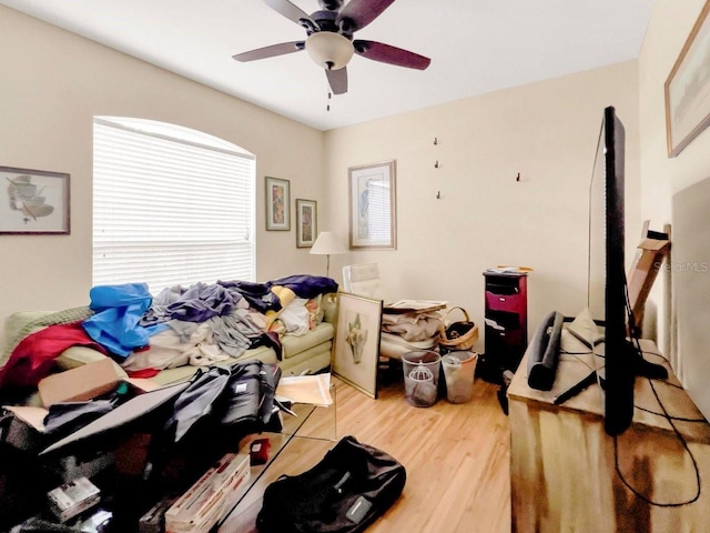 bedroom with hardwood / wood-style floors and ceiling fan