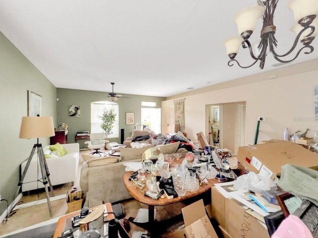 living room featuring ceiling fan with notable chandelier and carpet floors