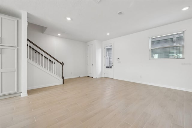 entrance foyer with light hardwood / wood-style flooring