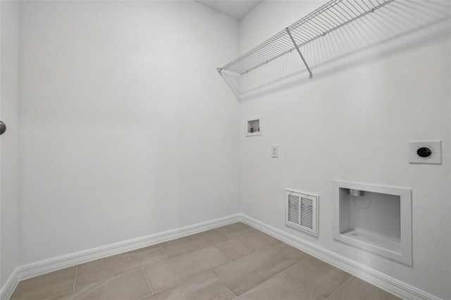 washroom with light tile patterned floors, hookup for a washing machine, and hookup for an electric dryer