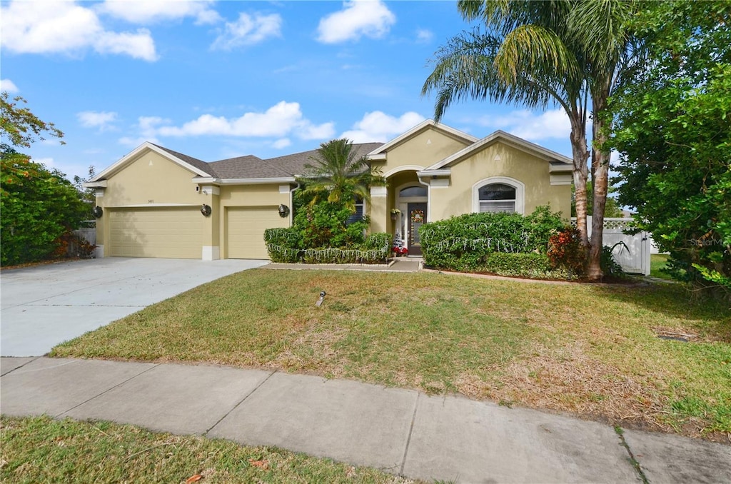 ranch-style house with a front lawn and a garage