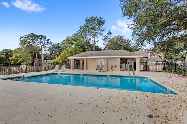 view of swimming pool with a patio