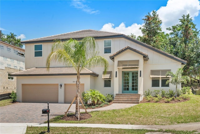 view of front facade featuring a garage and a front yard