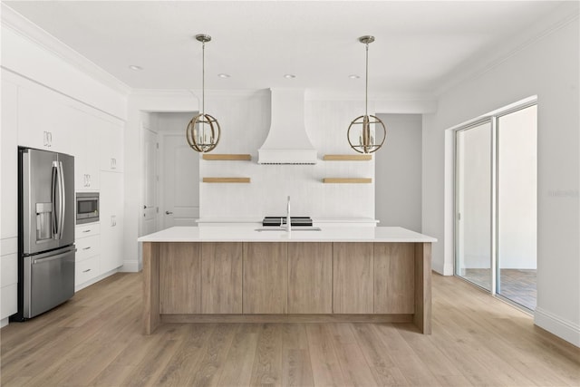 kitchen featuring white cabinetry, stainless steel appliances, a kitchen island with sink, and premium range hood