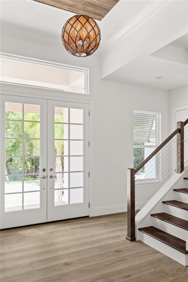 doorway to outside with light hardwood / wood-style floors and french doors