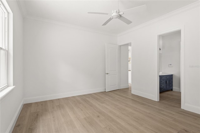 unfurnished bedroom with ceiling fan, ornamental molding, ensuite bathroom, and light wood-type flooring