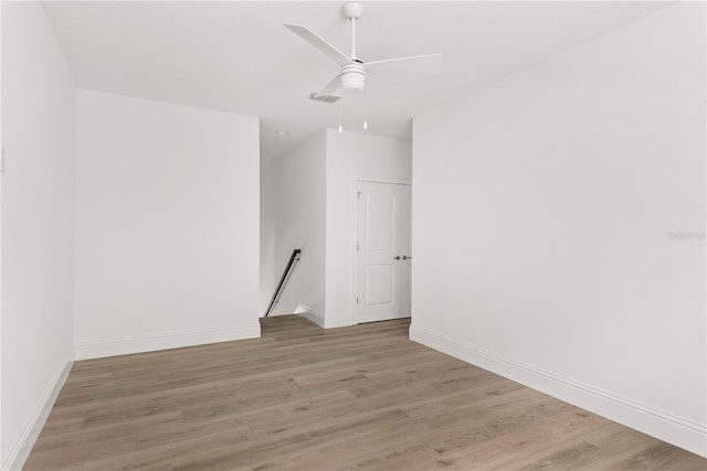 unfurnished room featuring ceiling fan and hardwood / wood-style floors