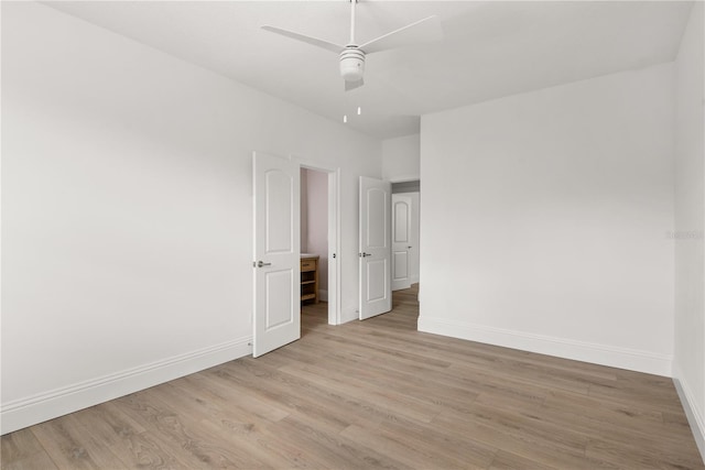 unfurnished bedroom with ceiling fan and light hardwood / wood-style flooring