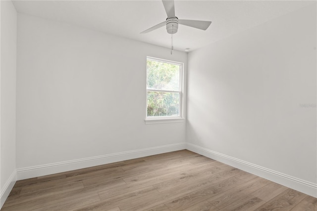 empty room with light hardwood / wood-style floors and ceiling fan