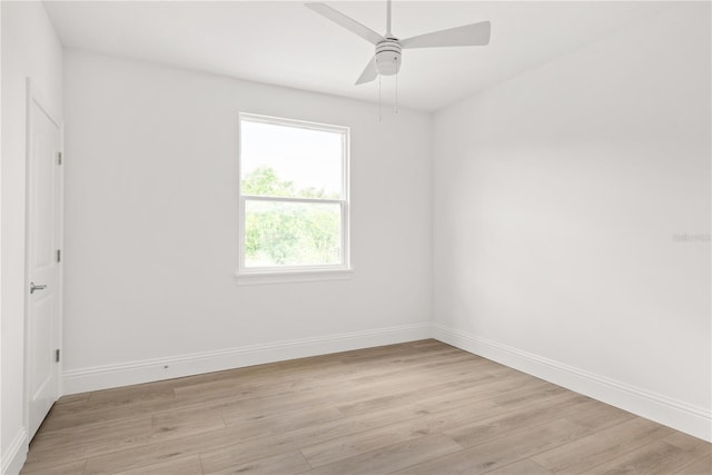 unfurnished room with ceiling fan and light wood-type flooring