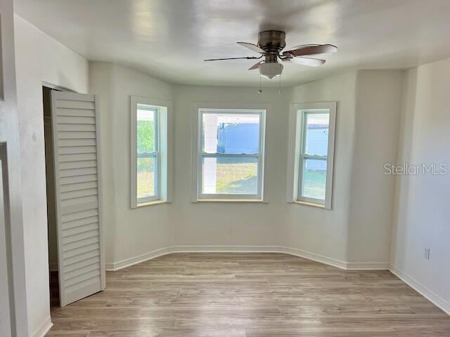 unfurnished bedroom with light hardwood / wood-style flooring and ceiling fan