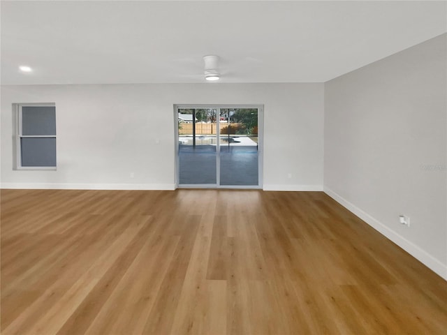 unfurnished room featuring light hardwood / wood-style flooring and ceiling fan