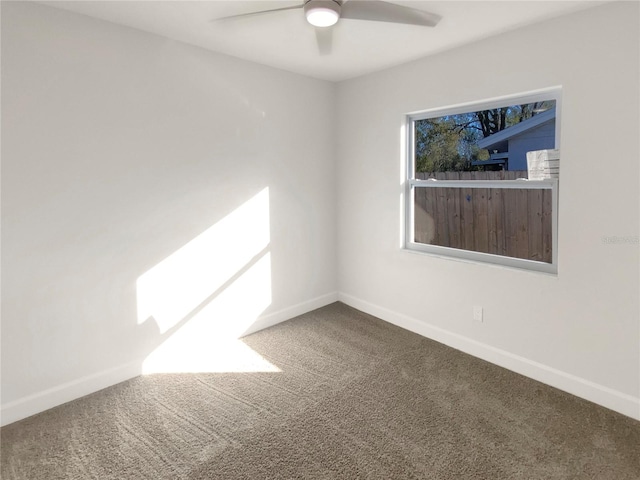 carpeted empty room with ceiling fan