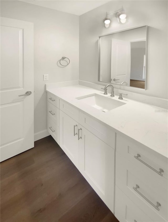 bathroom featuring hardwood / wood-style floors and vanity