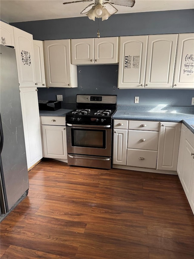 kitchen with ceiling fan, white cabinetry, dark wood-type flooring, and appliances with stainless steel finishes