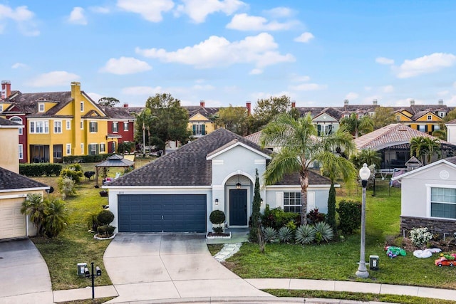 view of front facade with a garage and a front yard