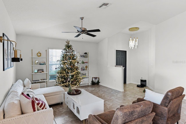 living room with ceiling fan with notable chandelier and lofted ceiling