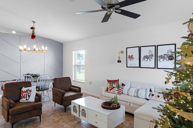 tiled living room with ceiling fan with notable chandelier