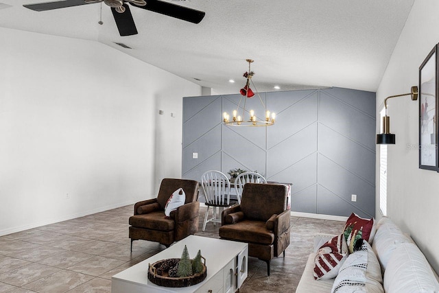 living room with a textured ceiling, ceiling fan with notable chandelier, and vaulted ceiling