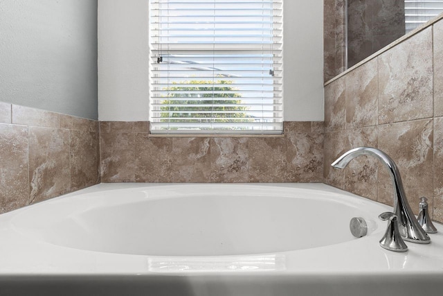 bathroom with a washtub