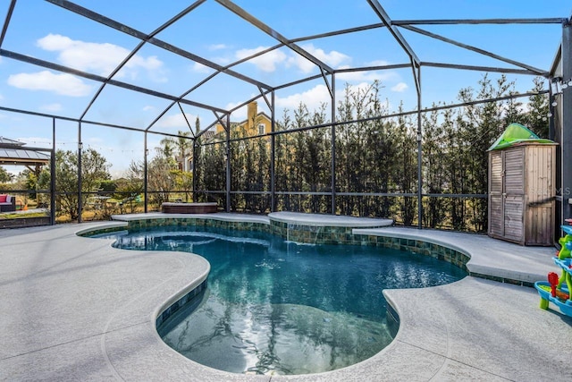 view of pool with glass enclosure and a patio