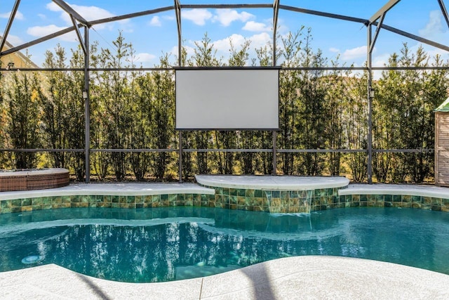 view of pool with a lanai