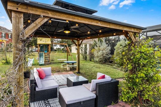 view of patio / terrace with a playground, an outdoor living space, ceiling fan, and a gazebo